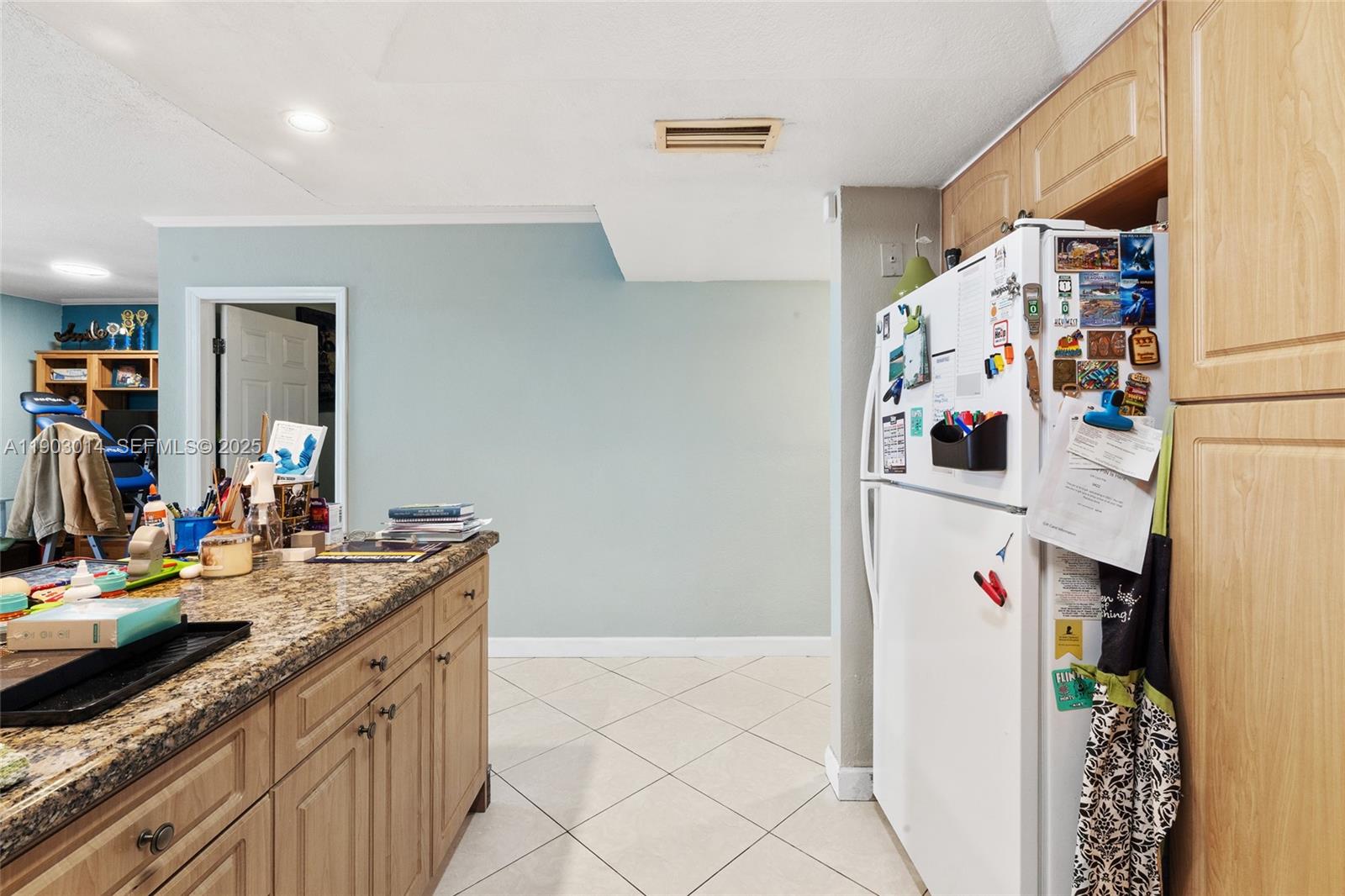 7144 West 2nd Lane Hialeah, FL 33014 - Photo 14 of 40 a kitchen with refrigerator and sink