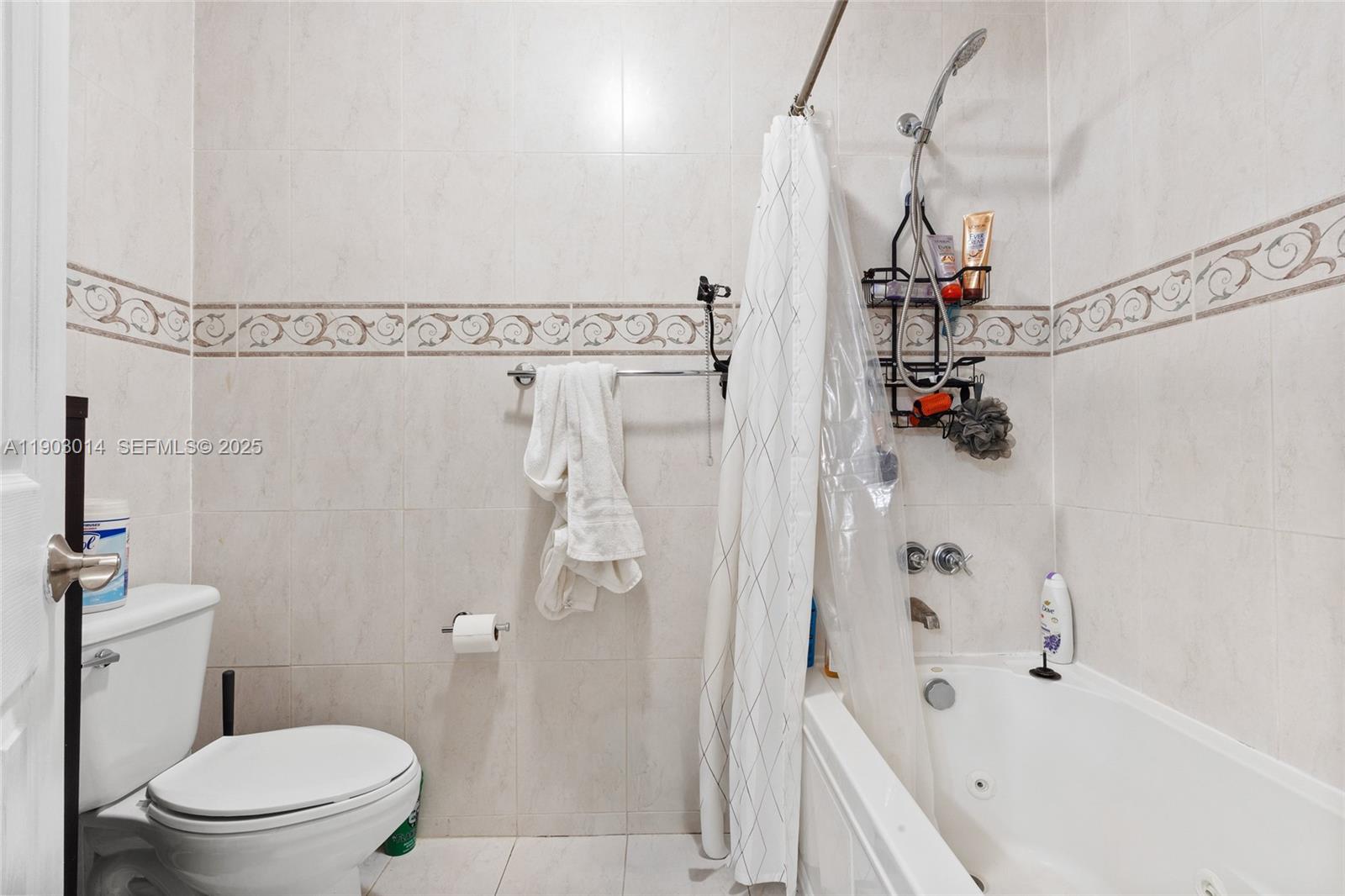 7144 West 2nd Lane Hialeah, FL 33014 - Photo 25 of 40 a bathroom with a sink a toilet and shower