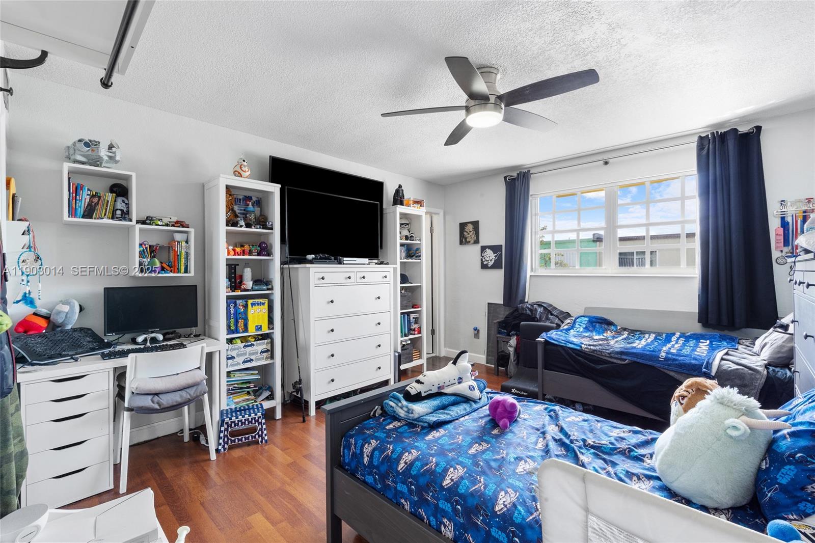 7144 West 2nd Lane Hialeah, FL 33014 - Photo 27 of 40 a living room with furniture and a flat screen tv