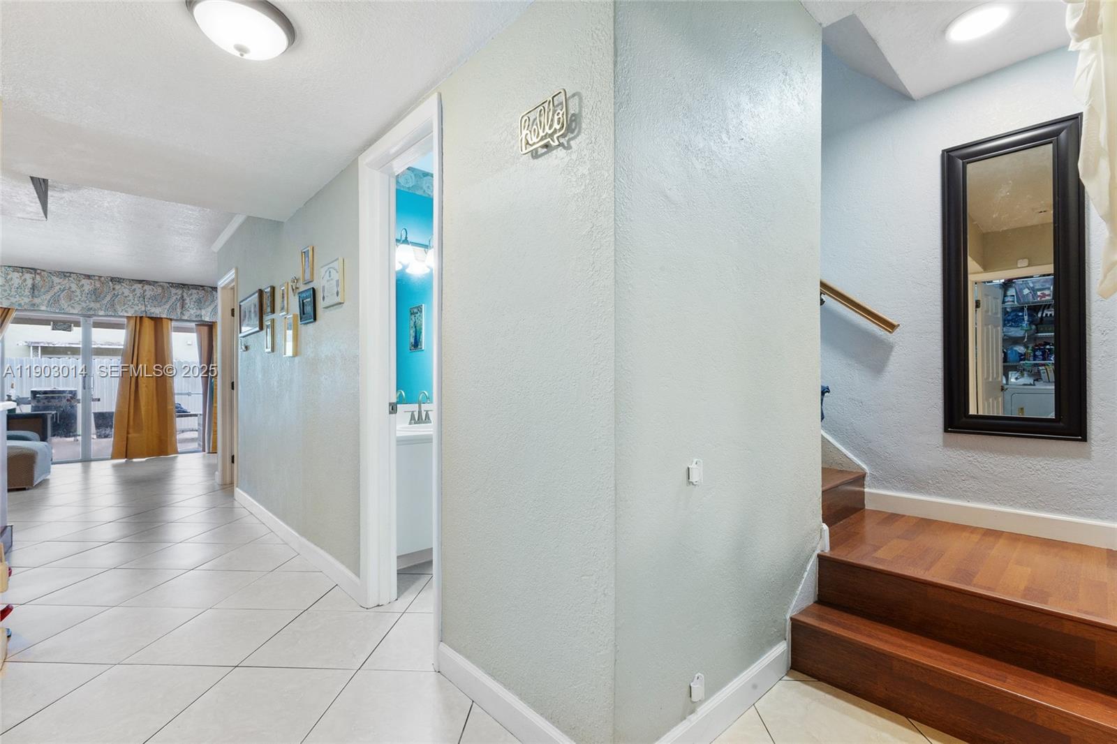 7144 West 2nd Lane Hialeah, FL 33014 - Photo 9 of 40 a view of an entryway with wooden floor