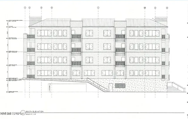 a black and white photo of a living room