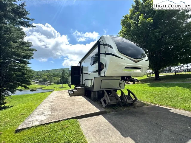 a childrens park with lots of swings and slides and swimming pool