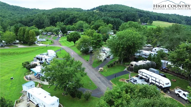 an aerial view of a golf course with parking space