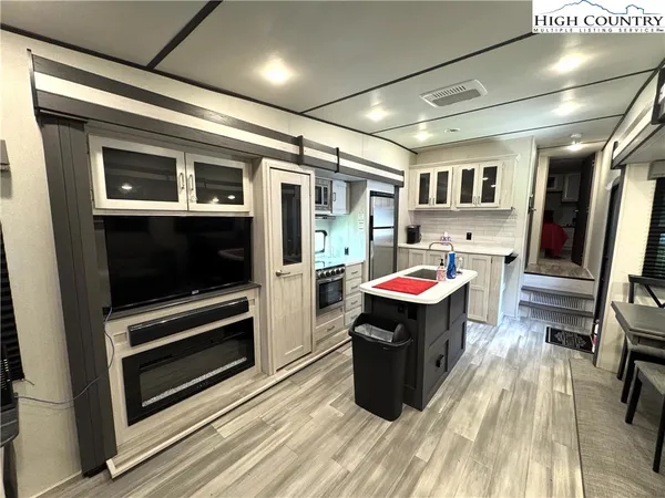 a kitchen with a stove and a refrigerator