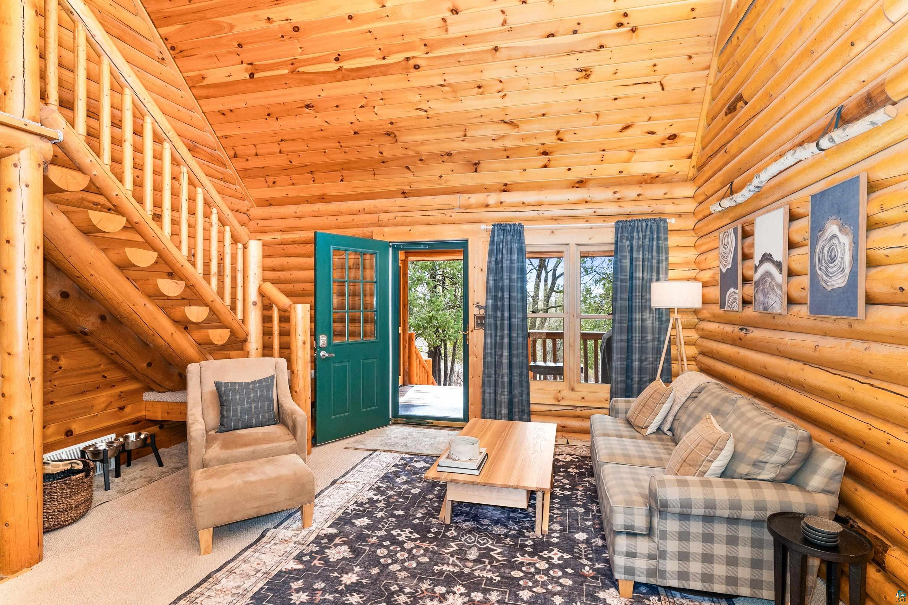 2659 Ridgeview Drive Two Harbors, MN 55616 - Photo 12 of 56 Log cabin interior featuring a vaulted wood-plank ceiling and exposed log walls