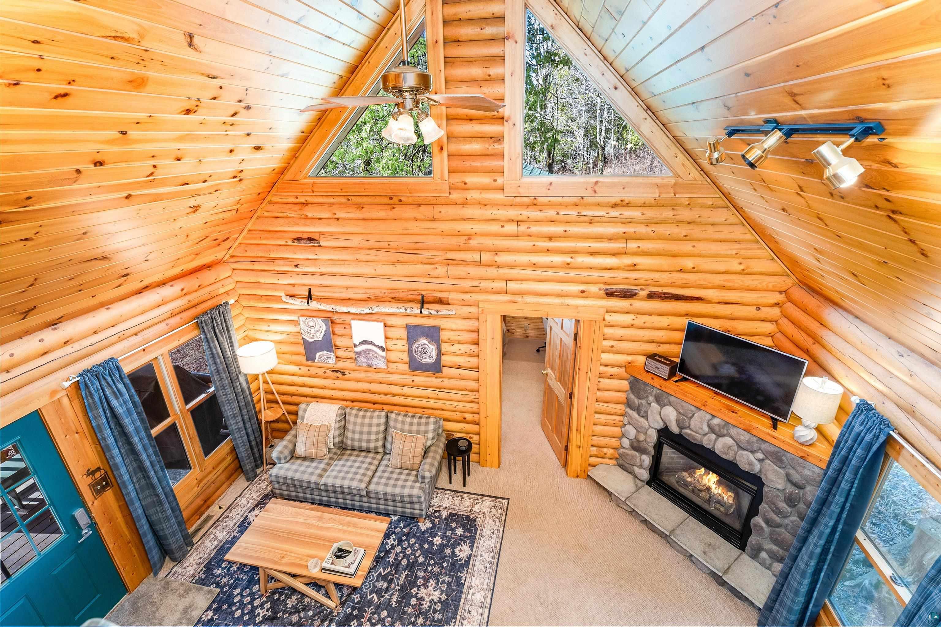 2659 Ridgeview Drive Two Harbors, MN 55616 - Photo 35 of 56 Vaulted wood-paneled ceilings with exposed beams and a ceiling fan