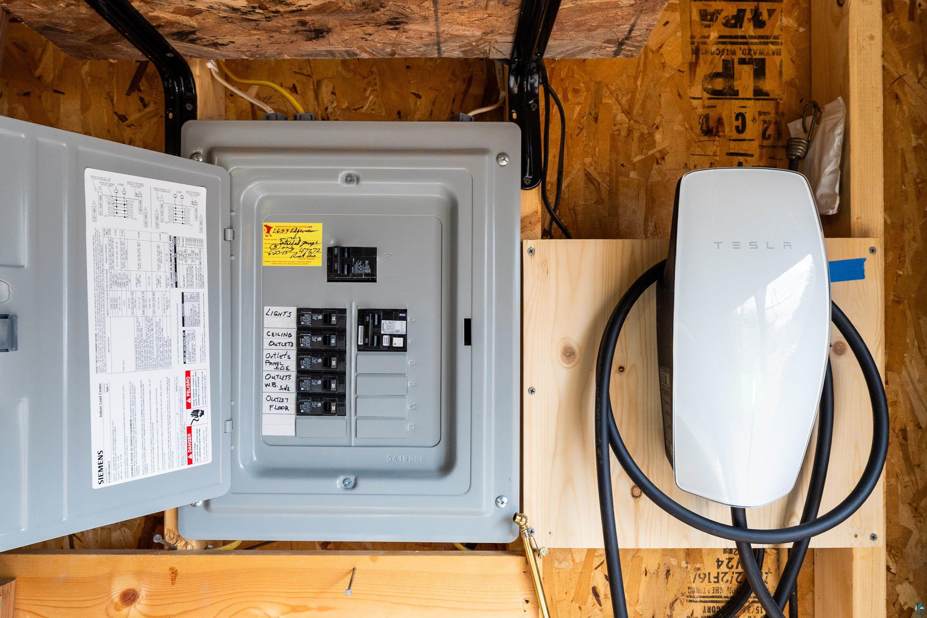 2659 Ridgeview Drive Two Harbors, MN 55616 - Photo 49 of 56 Electrical panel and integrated EV charging station featuring a wall-mounted charger and organized cabling