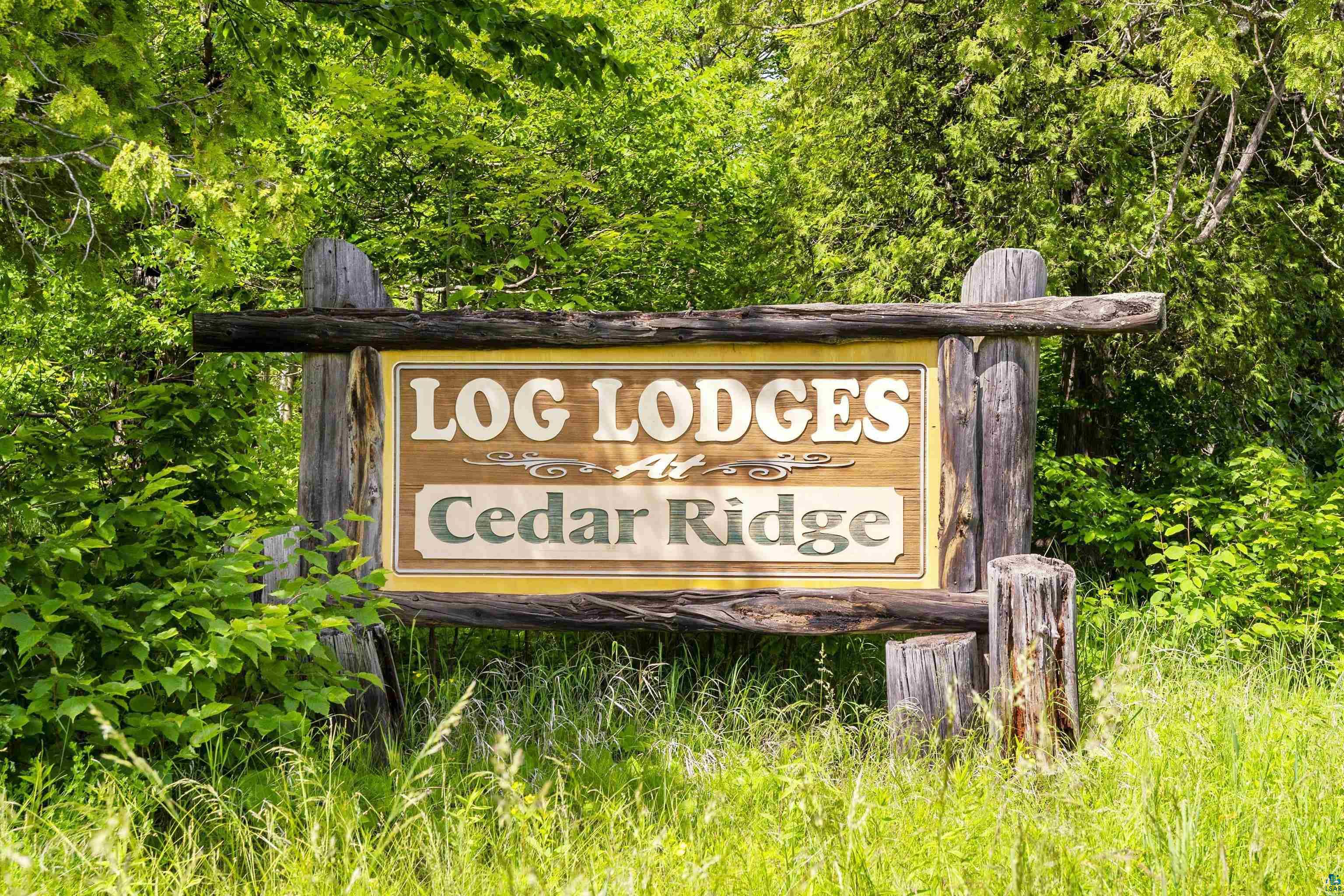 2659 Ridgeview Drive Two Harbors, MN 55616 - Photo 56 of 56 Rustic wooden sign for "Log Lodges at Cedar Ridge" featuring log post construction