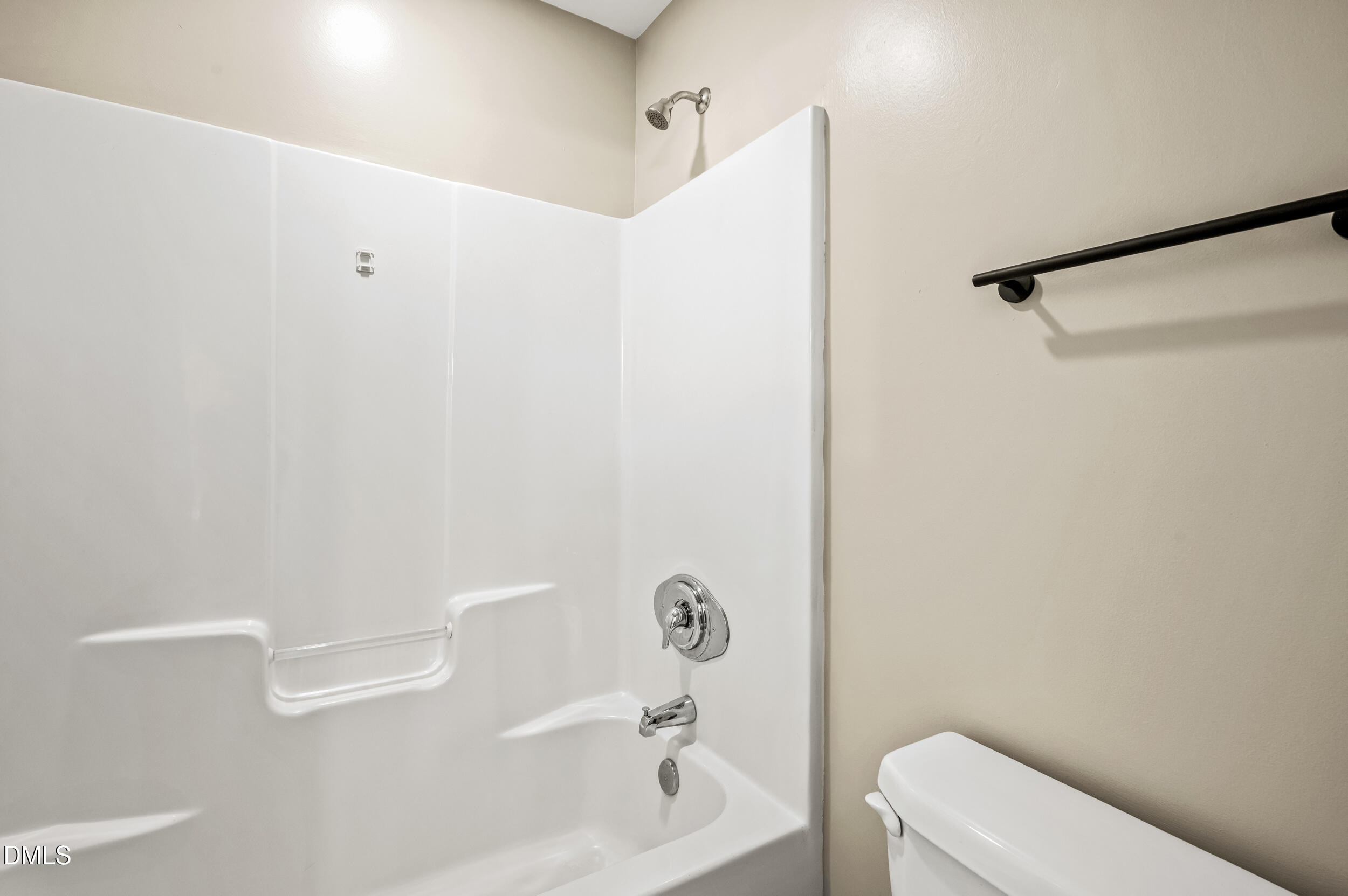 1957 Hilltop Road Raleigh, NC 27610 - Photo 25 of 46 a bathroom with a toilet and a shower