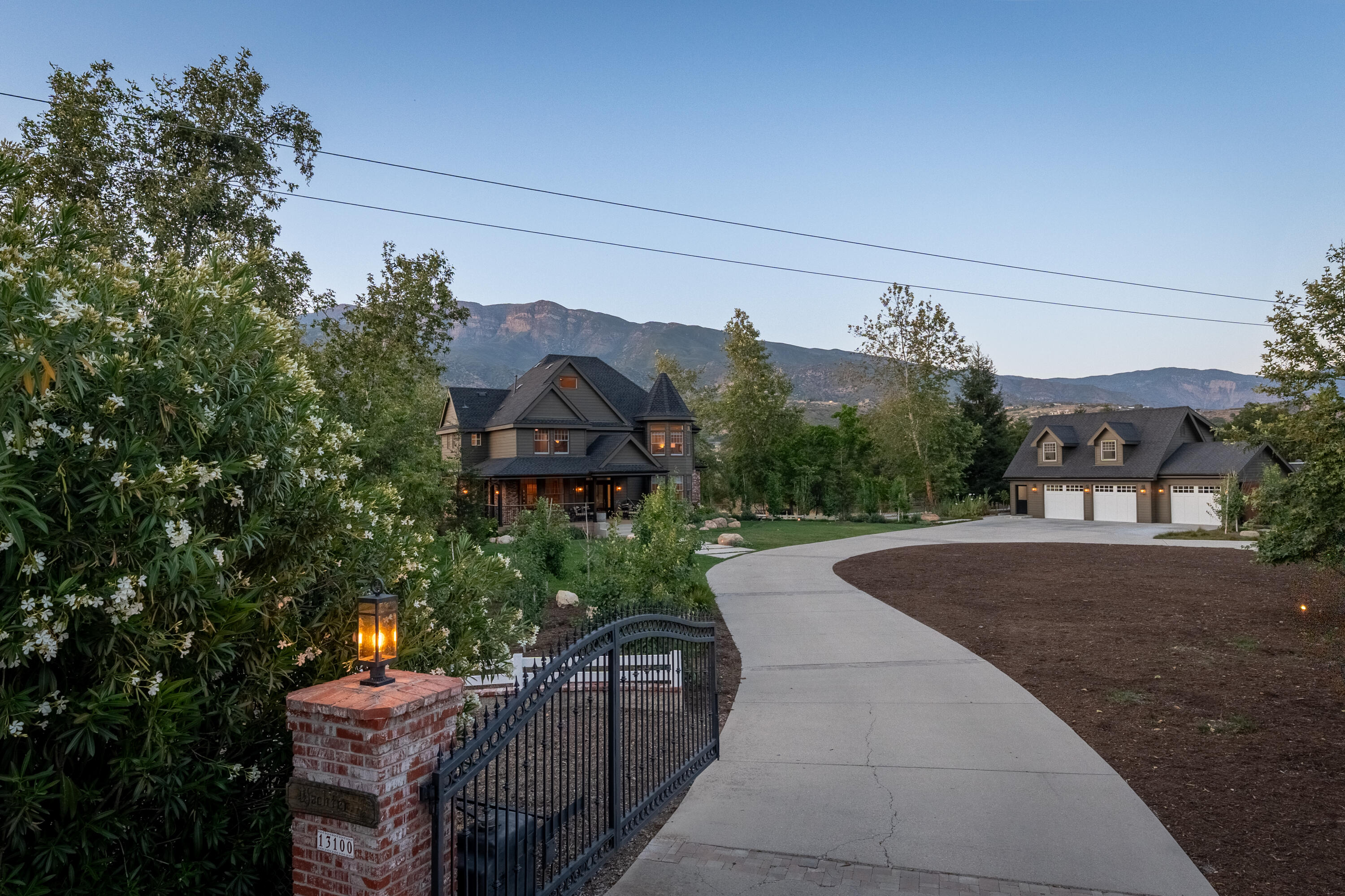 13100 Ojai Road Santa Paula, CA 93060 - Photo 59 of 60 a view of a house with a small yard and a large tree