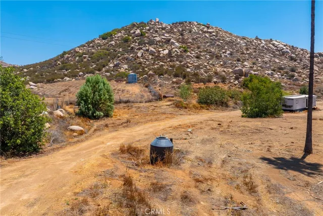 a view of a backyard of the house
