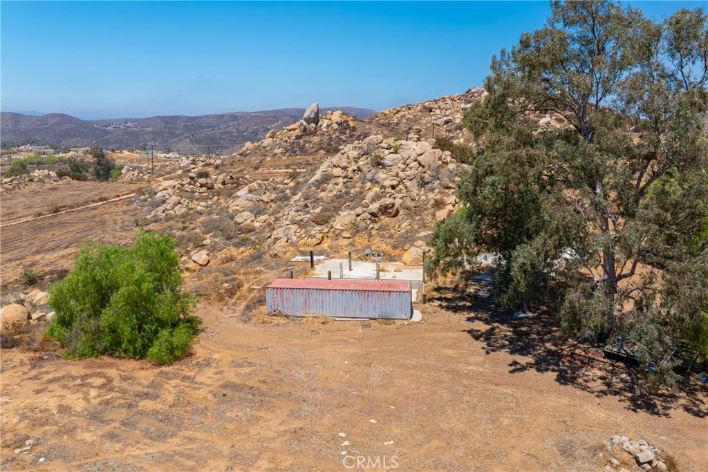 24900 El Toro Road Perris, CA 92570 - Photo 6 of 36 a view of a dry yard with mountains in the background