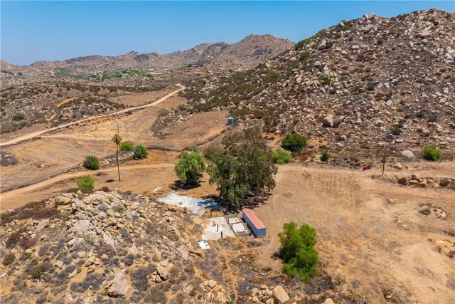 a view of a yard with a mountain view