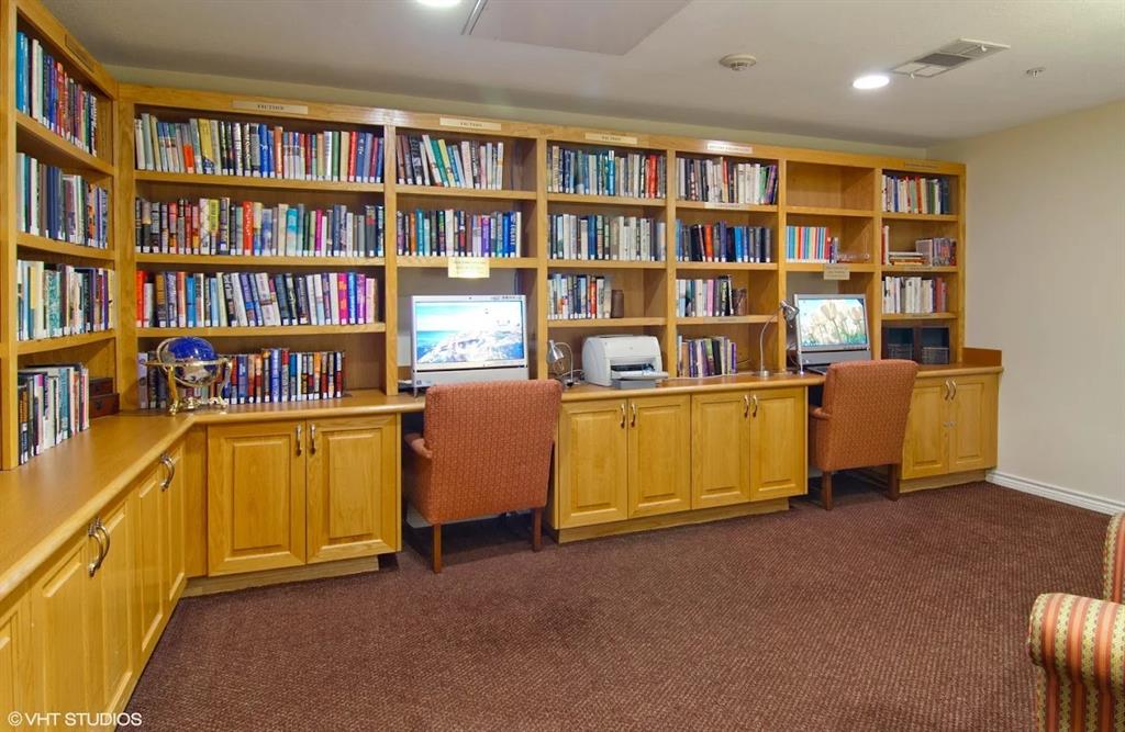 8707 Valley Ranch Parkway West, Unit 335 Irving, TX 75063 - Photo 9 of 11 a view of a workspace with furniture and cabinet