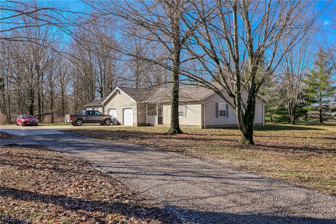8464-8446 Tallmadge Road Diamond, OH 44412 - Photo 33 of 39 Ranch-style home featuring an attached garage and driveway