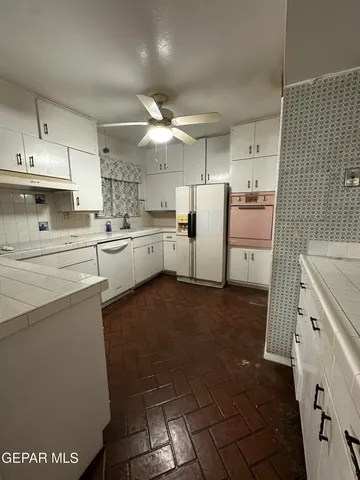 a view of a hallway with a chandelier
