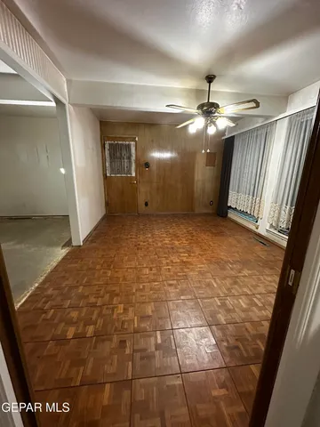 a view of room with a ceiling fan