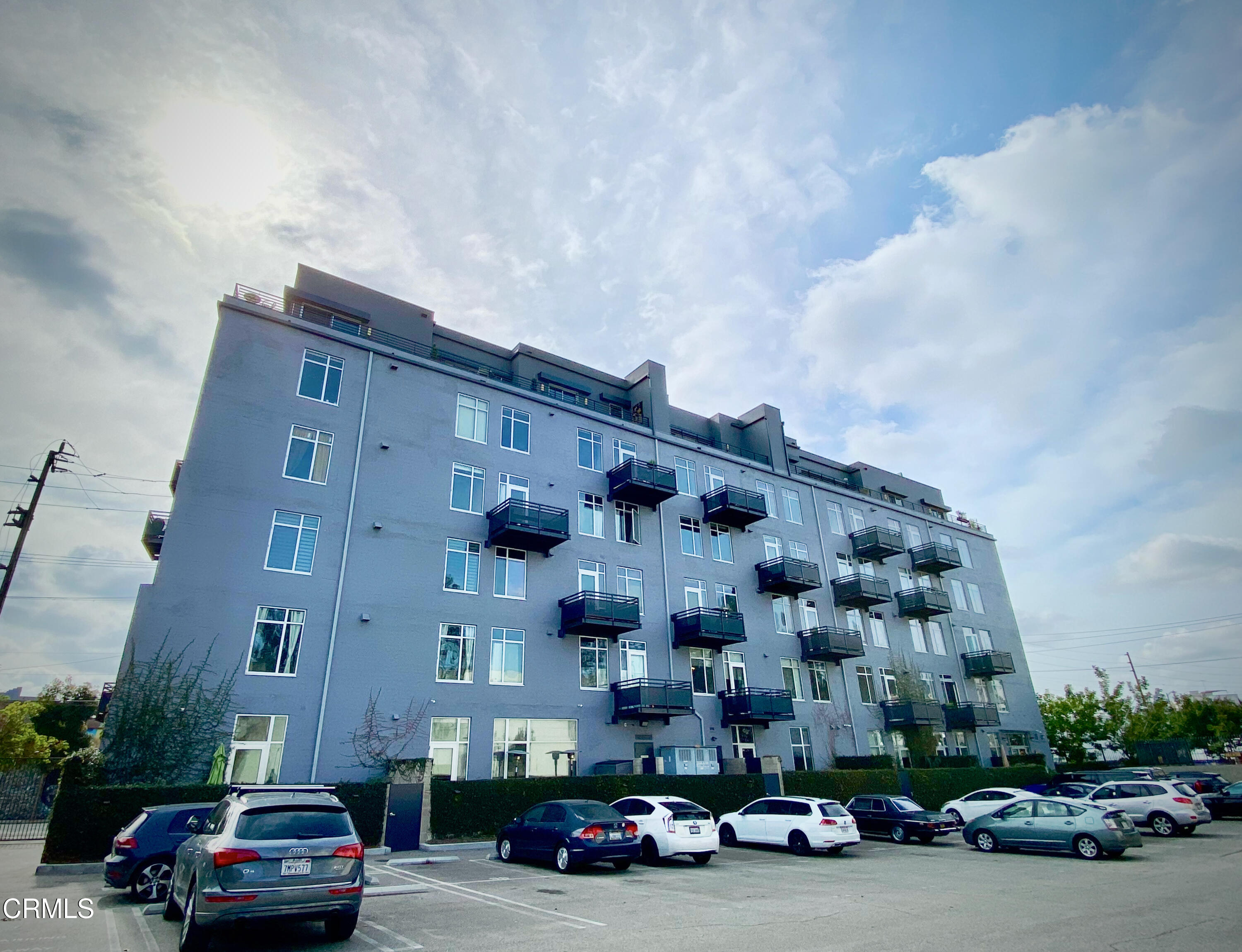 825 East 4th Street, Unit 501 Los Angeles, CA 90013 - Photo 14 of 19 a car parked in front of a building