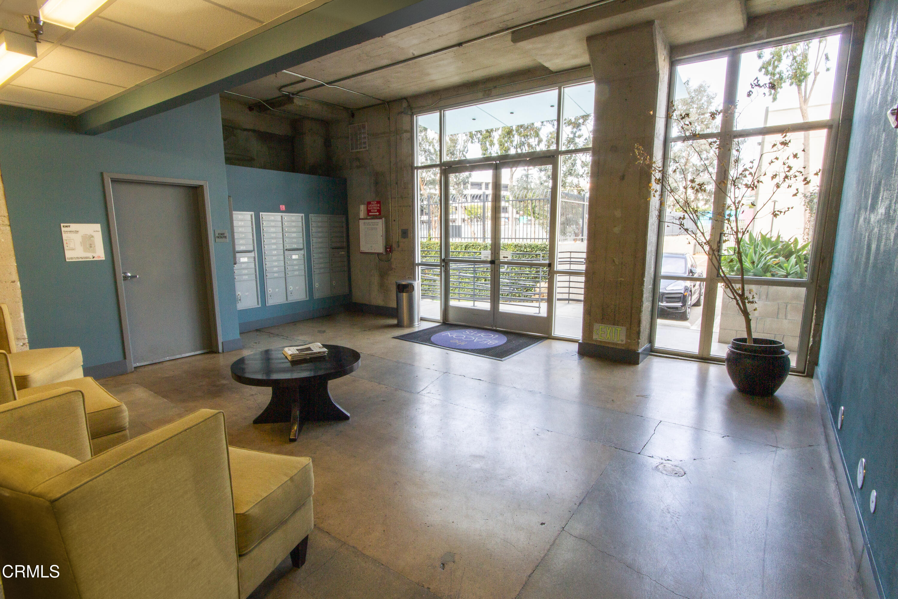 825 East 4th Street, Unit 501 Los Angeles, CA 90013 - Photo 18 of 19 a living room with furniture and a large window with outer view
