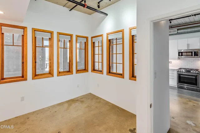 a bathroom with a double vanity sink toilet mirror and bathtub