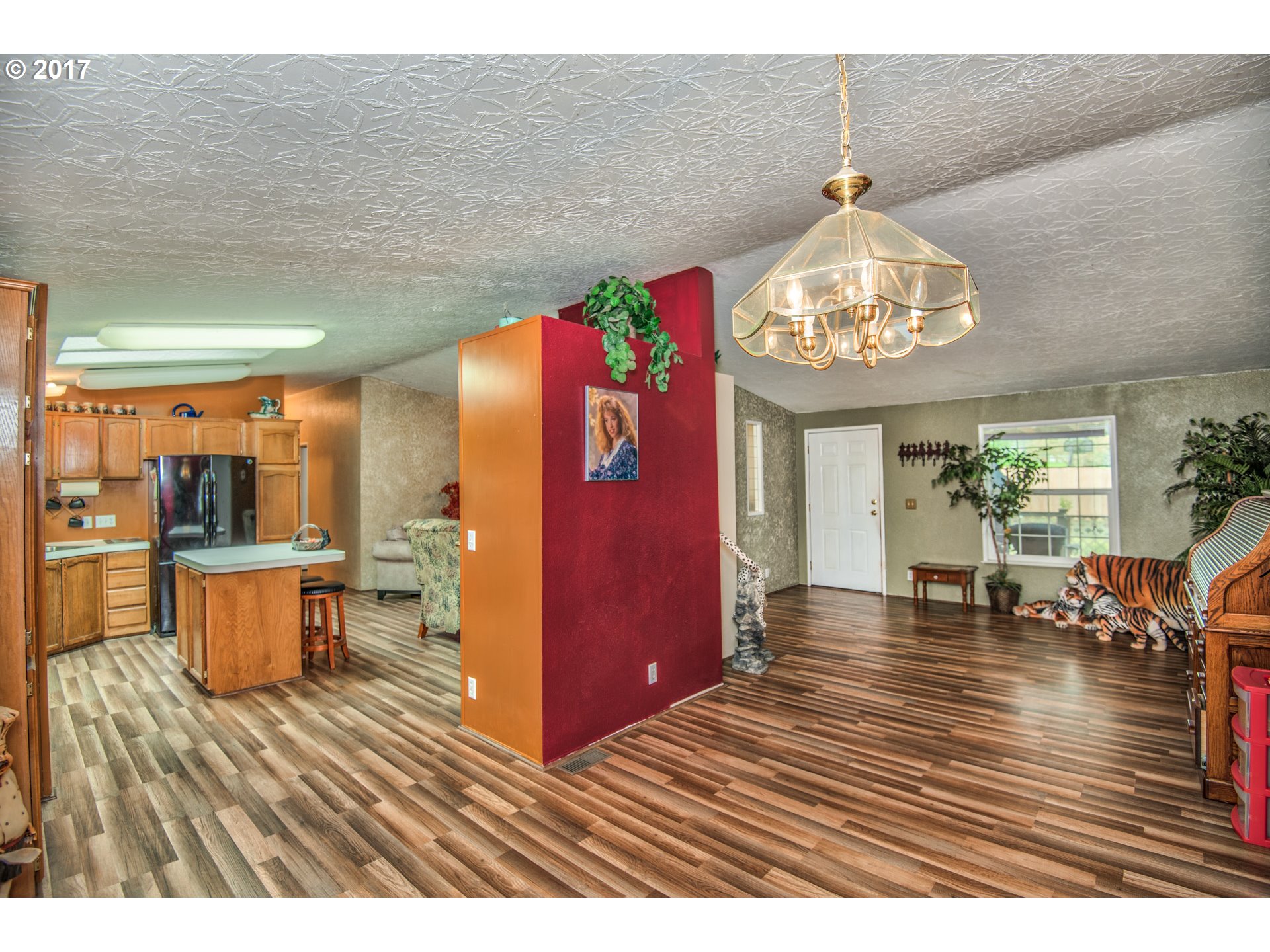 29964 South Hult Road Colton, OR 97017 - Photo 2 of 17 a view of a dining room with furniture a chandelier and wooden floor