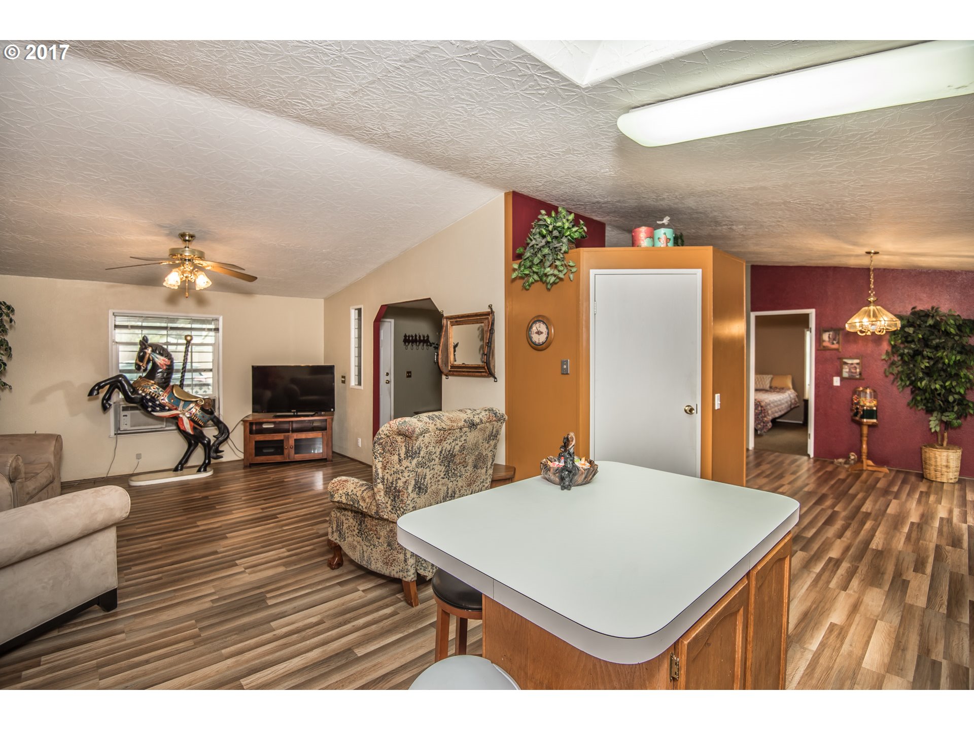 29964 South Hult Road Colton, OR 97017 - Photo 4 of 17 a living room with furniture a flat screen tv and a table