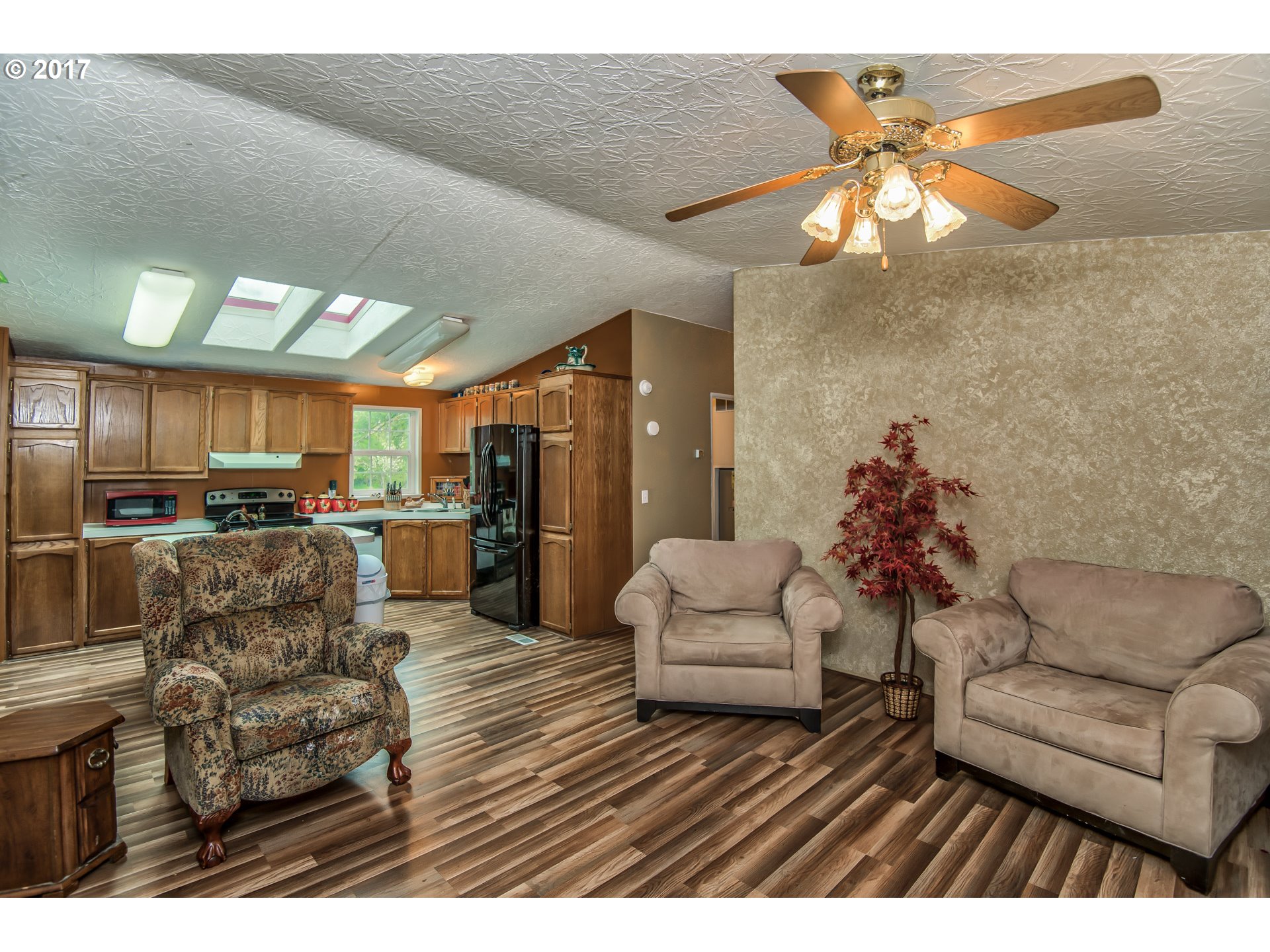 29964 South Hult Road Colton, OR 97017 - Photo 5 of 17 a living room with furniture kitchen and a chandelier