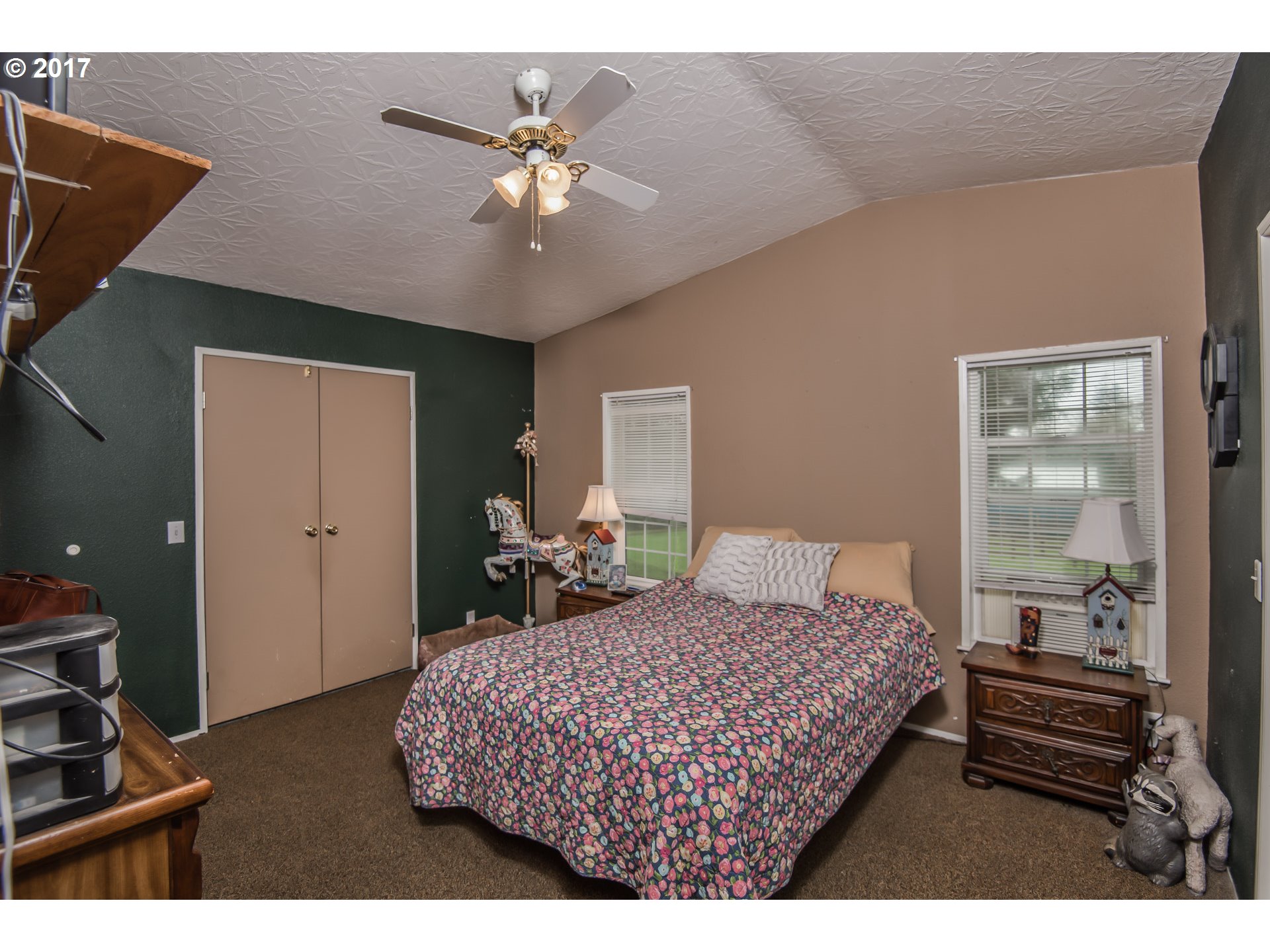 29964 South Hult Road Colton, OR 97017 - Photo 8 of 17 a bedroom with a bed and a chandelier
