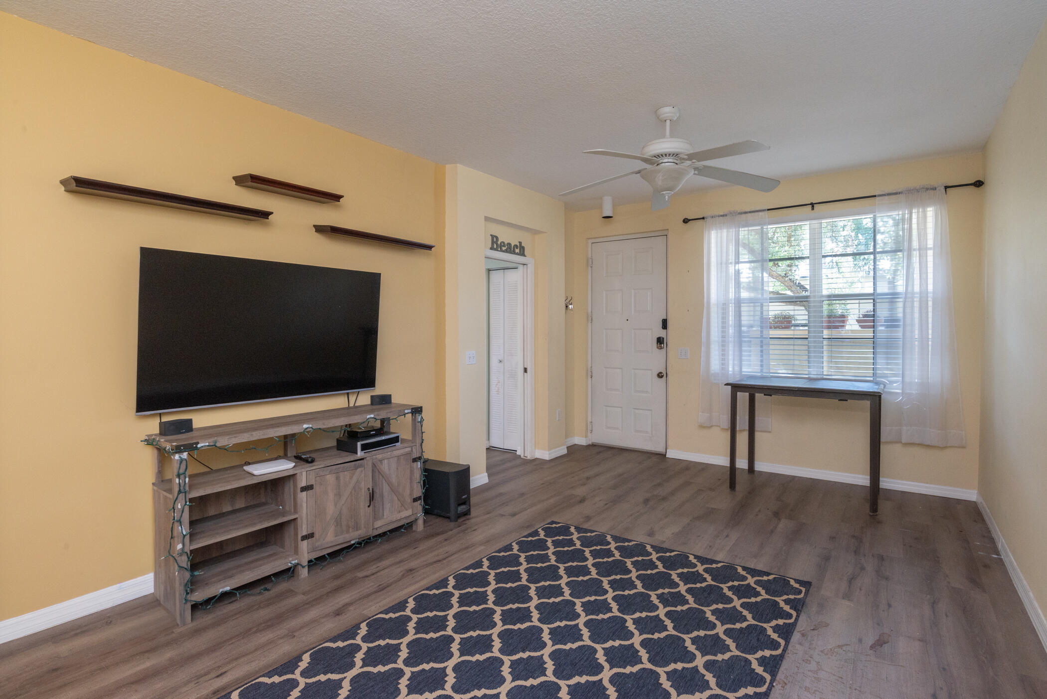 1140 University Boulevard, Unit 10 Jupiter, FL 33458 - Photo 11 of 21 Foyer and Great Room