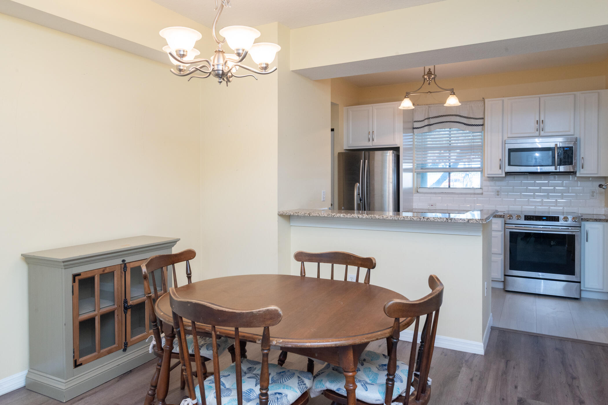 1140 University Boulevard, Unit 10 Jupiter, FL 33458 - Photo 7 of 21 Dining Area and Kitchen