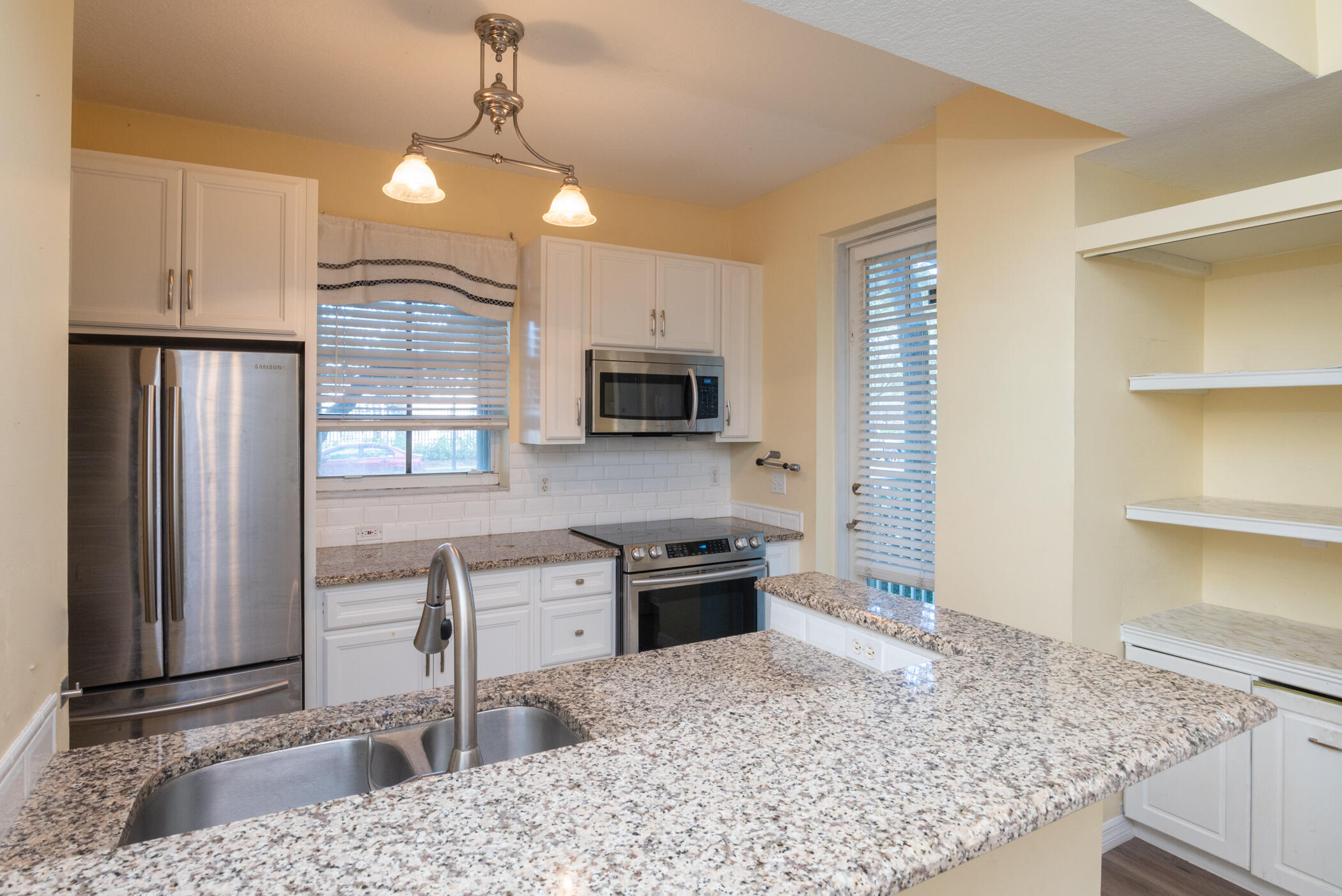 1140 University Boulevard, Unit 10 Jupiter, FL 33458 - Photo 9 of 21 Kitchen and Pantry
