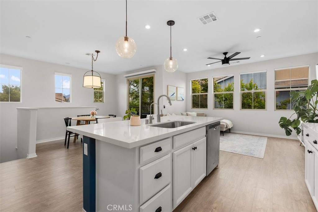 128 Natal Road Rancho Mission Viejo, CA 92694 - Photo 15 of 30 a large kitchen with kitchen island a sink and a stove