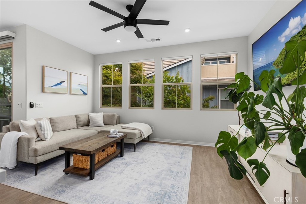 128 Natal Road Rancho Mission Viejo, CA 92694 - Photo 16 of 30 a living room with furniture and a potted plant
