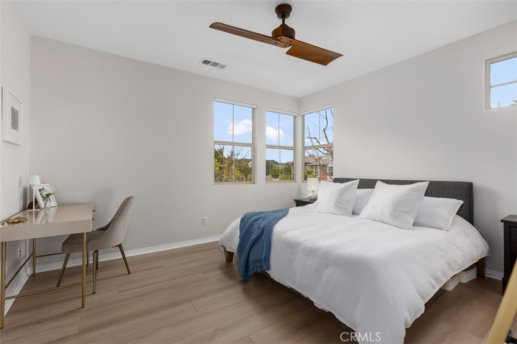 128 Natal Road Rancho Mission Viejo, CA 92694 - Photo 20 of 30 a bedroom with a bed a table and chair