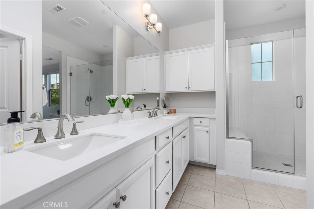 128 Natal Road Rancho Mission Viejo, CA 92694 - Photo 21 of 30 a bathroom with a sink a vanity and a mirror