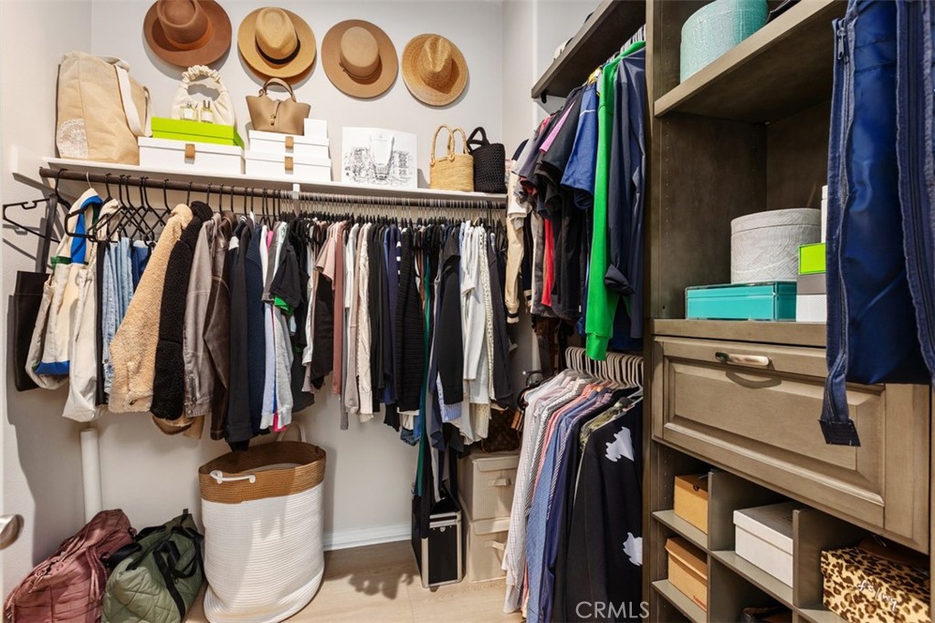 128 Natal Road Rancho Mission Viejo, CA 92694 - Photo 23 of 30 a view of walk in closet with clothes and shoes