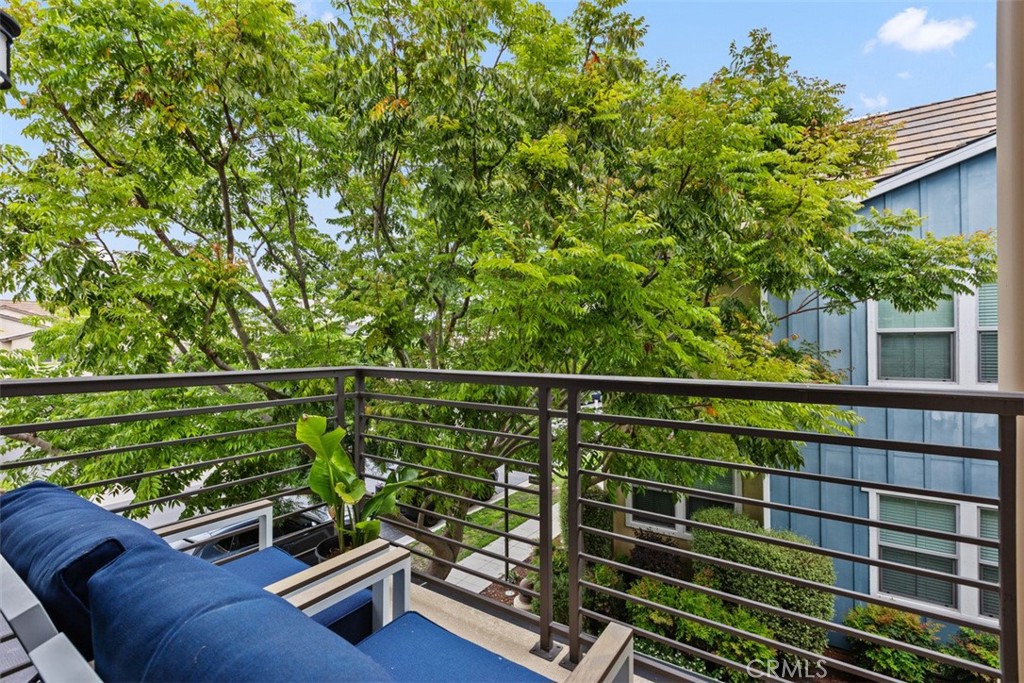 128 Natal Road Rancho Mission Viejo, CA 92694 - Photo 24 of 30 a view of a balcony with two chairs and a potted plant