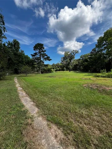 a view of a golf course with a garden