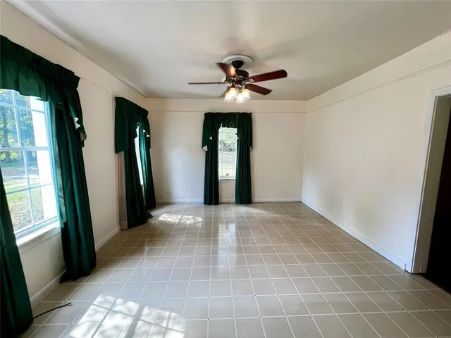 a view of an empty room with glass door