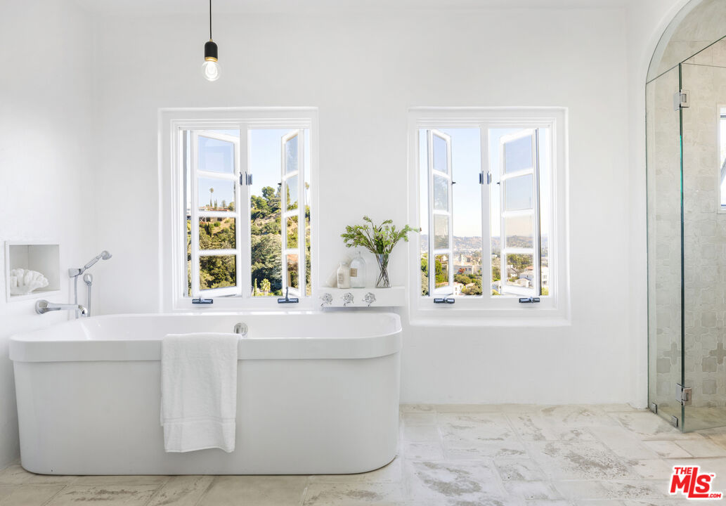 4565 Dundee Drive Los Angeles, CA 90027 - Photo 19 of 42 a bathroom with a sink and a mirror