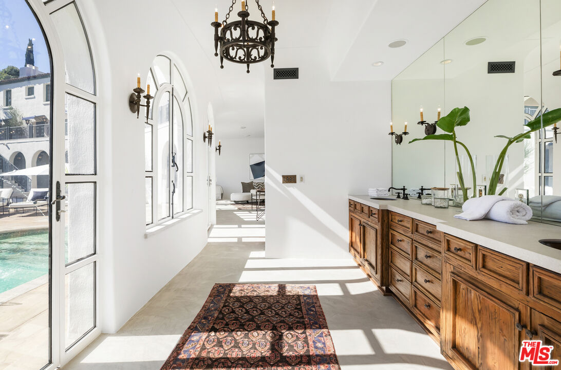 4565 Dundee Drive Los Angeles, CA 90027 - Photo 32 of 42 a bathroom with a sink and a mirror
