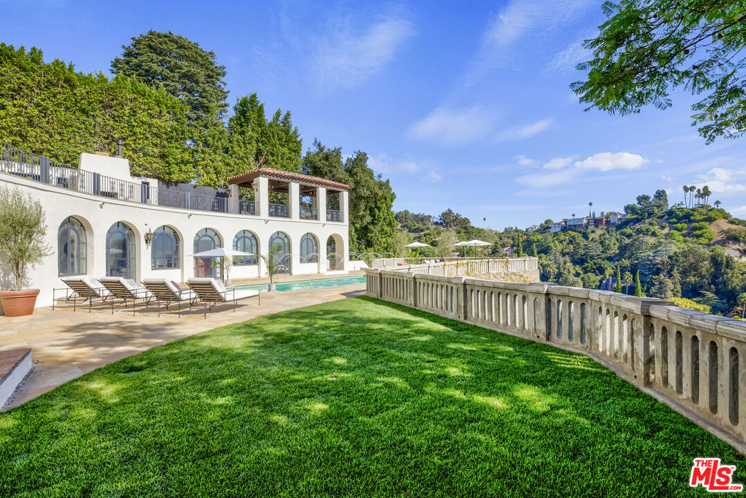 4565 Dundee Drive Los Angeles, CA 90027 - Photo 35 of 42 a view of a house with backyard and sitting area