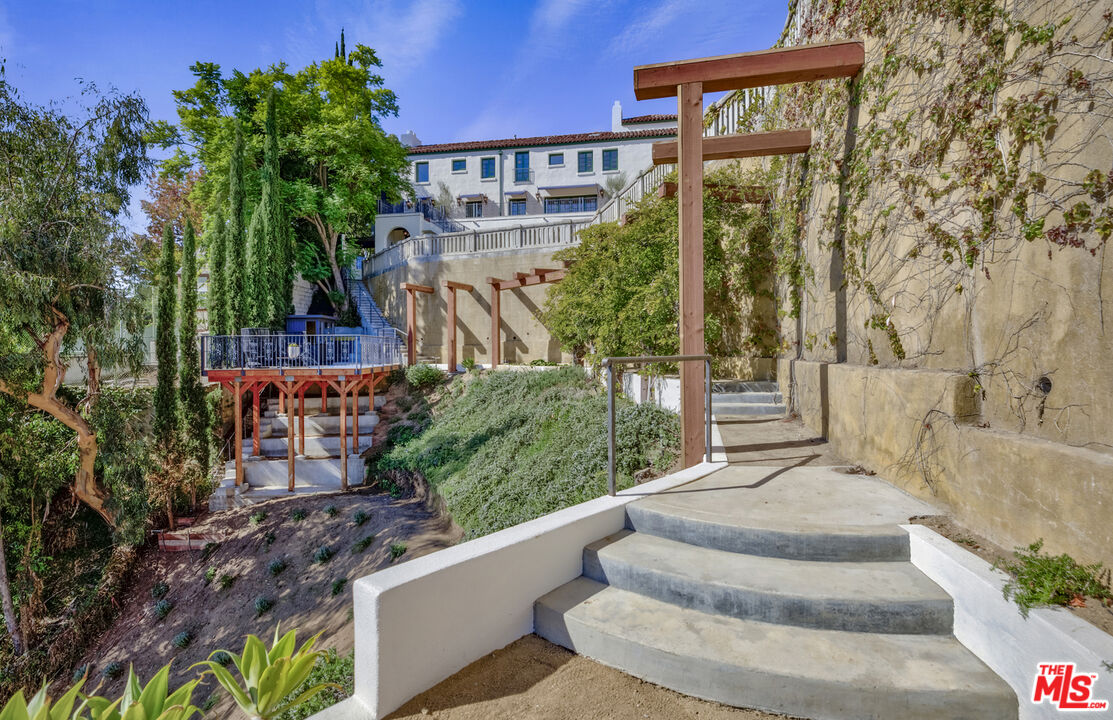 4565 Dundee Drive Los Angeles, CA 90027 - Photo 39 of 42 a front view of a house with garden