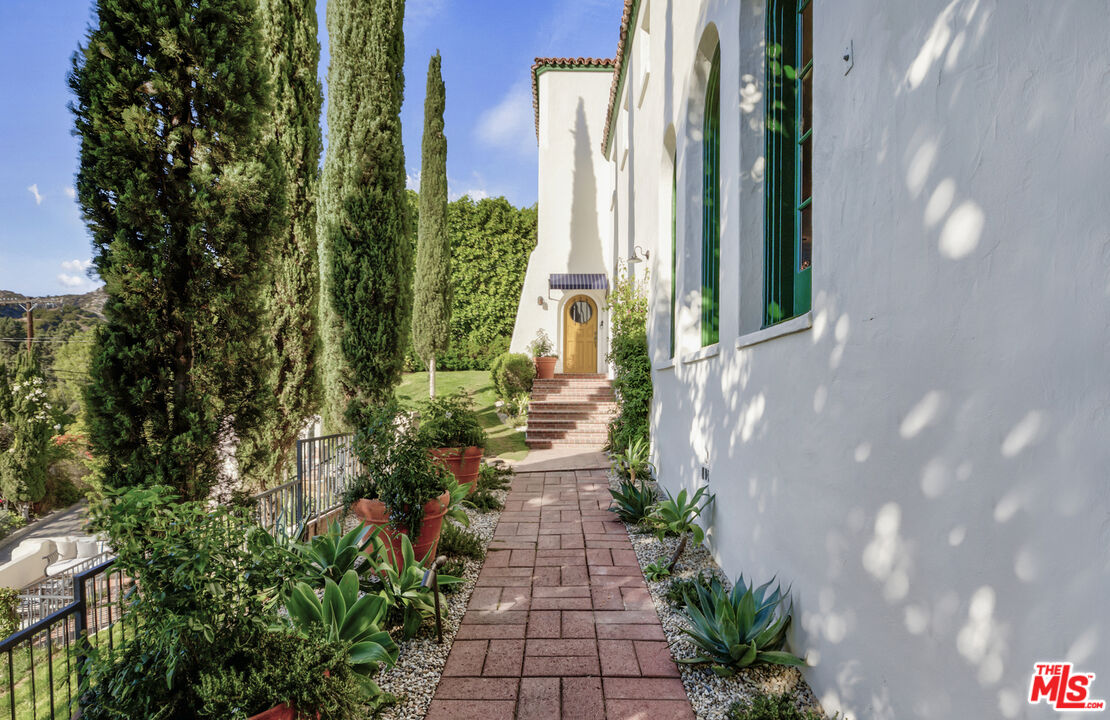 4565 Dundee Drive Los Angeles, CA 90027 - Photo 5 of 42 a view of a pathway with flower plants