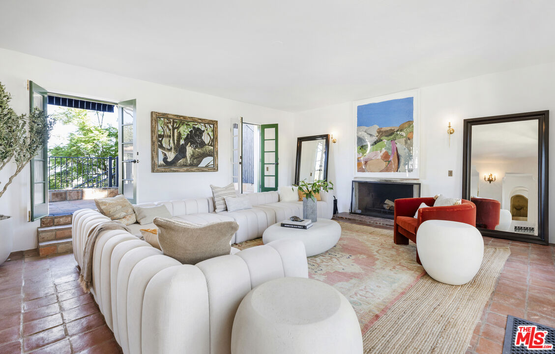 4565 Dundee Drive Los Angeles, CA 90027 - Photo 7 of 42 a living room with furniture and a wooden floor