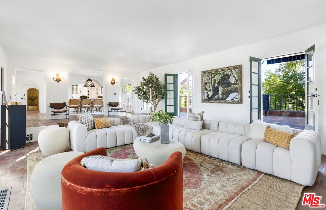 4565 Dundee Drive Los Angeles, CA 90027 - Photo 8 of 42 a living room with furniture and a large window