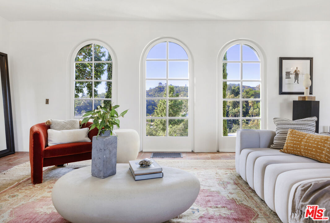 4565 Dundee Drive Los Angeles, CA 90027 - Photo 9 of 42 a living room with furniture and window
