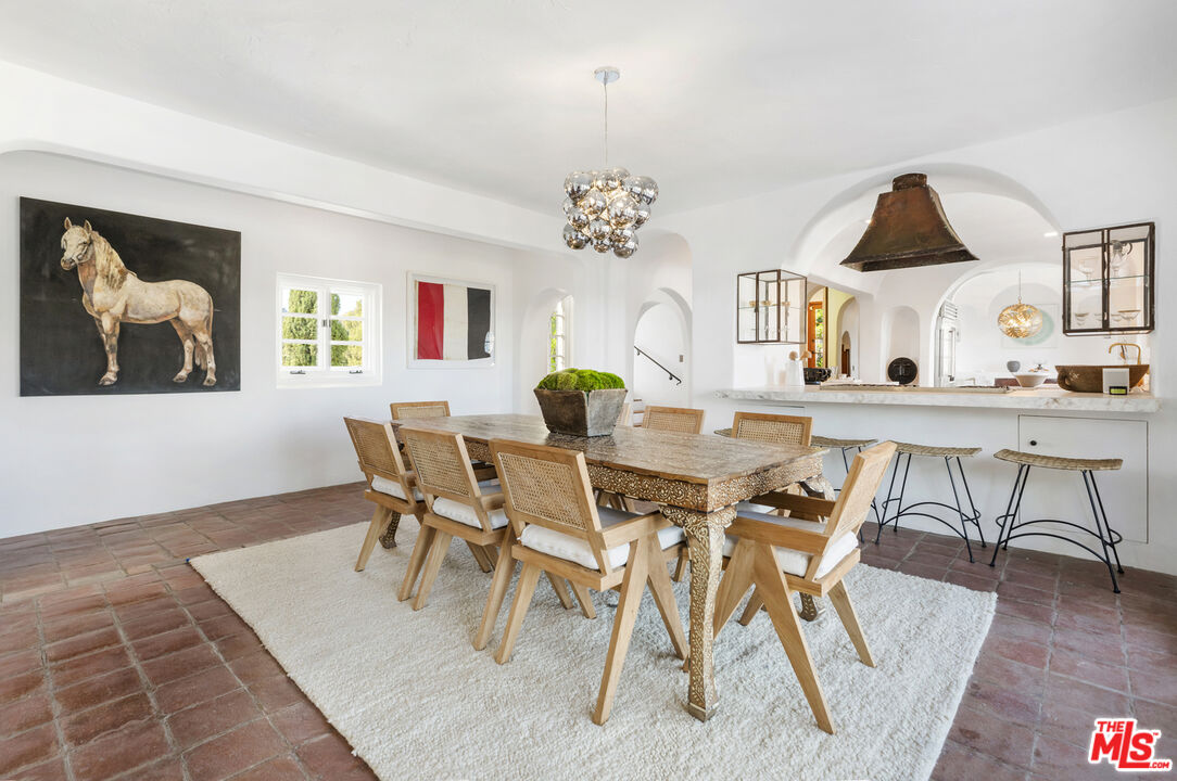 4565 Dundee Drive Los Angeles, CA 90027 - Photo 10 of 42 a view of a dining room with furniture and wooden floor