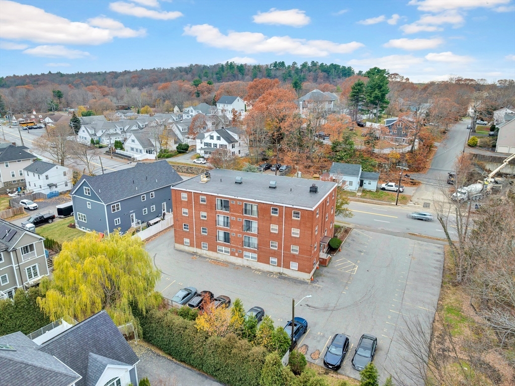 588 Main Street, Unit 3C Stoneham, MA 02180 - Photo 5 of 24 an aerial view of residential houses with outdoor space