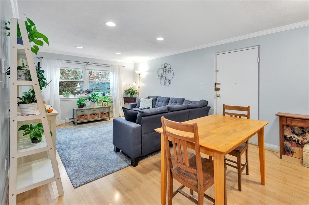 588 Main Street, Unit 3C Stoneham, MA 02180 - Photo 6 of 24 a living room with furniture and a large window